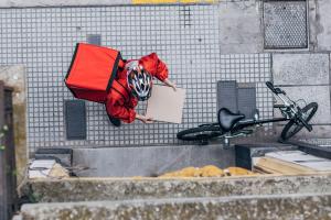 Ex-Afghan minister delivers food on bicycle in Germany